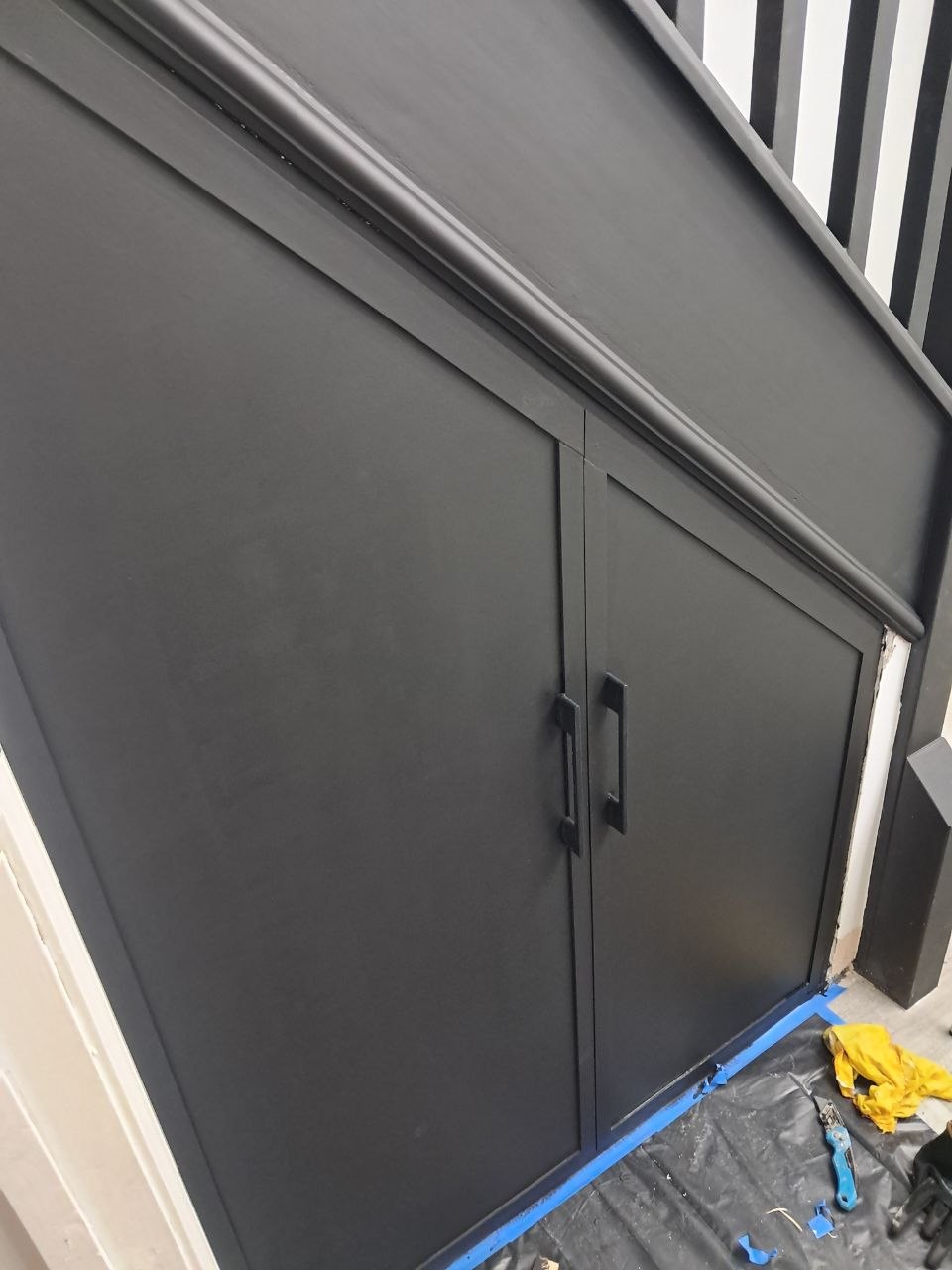 Painted black understairs joinery, after