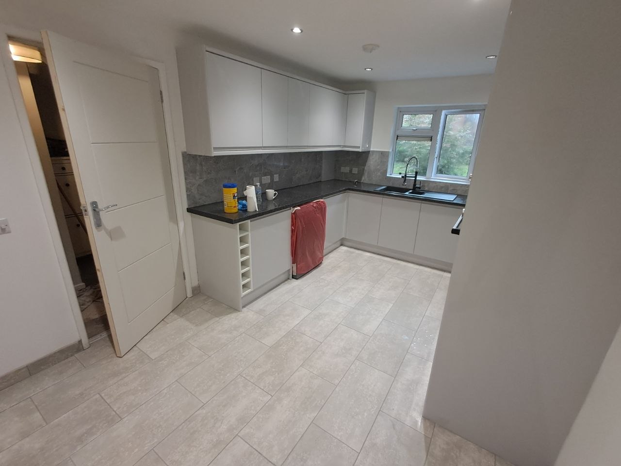 Finished white gloss kitchen, alternate angle
