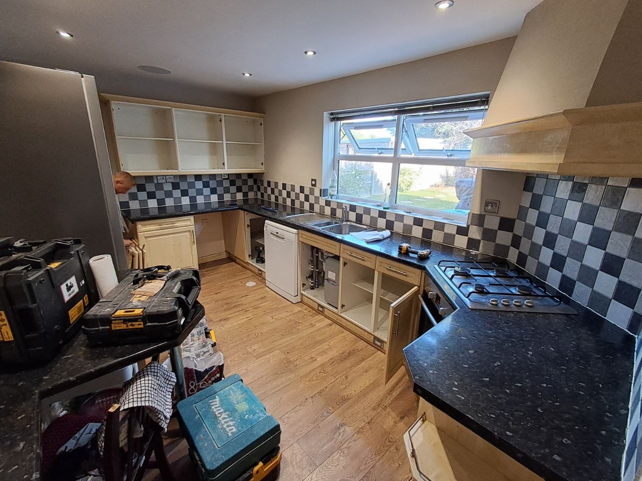 Black gloss kitchen renovation, stage photo
